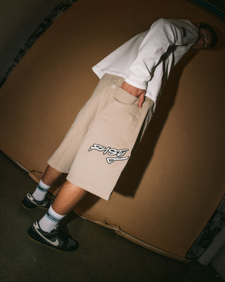 Man wearing Step-stone Baggy Short in Abbey Stone