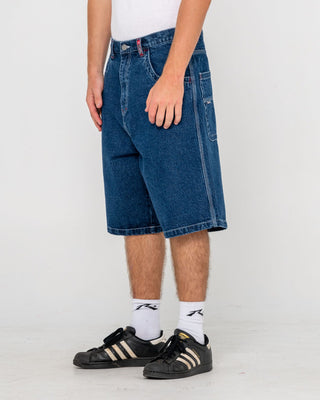 Man wearing Turbo Baggy Jort in Deep Sea Blue
