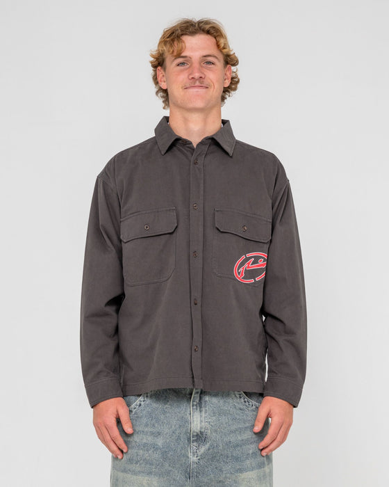 man-wearing-button-thru-over-shirt-in-coal