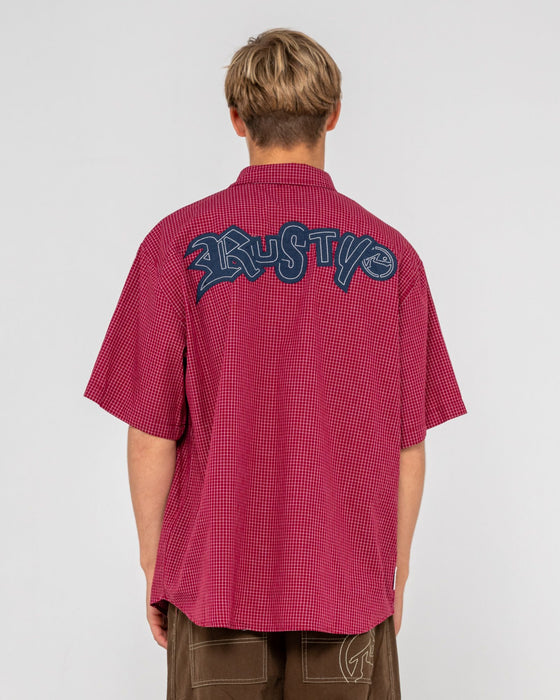 man-wearing-ransom-check-short-sleeve-shirt-in-burgundy