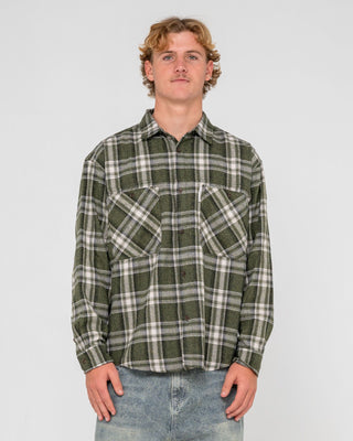 Man wearing Cobra Flannel Long Sleeve Shirt in Army Green