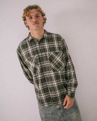 Man wearing Cobra Flannel Long Sleeve Shirt in Army Green