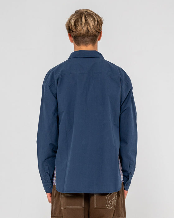 man-wearing-northpoint-plaid-panel-l-s-shirt-in-navy-blue