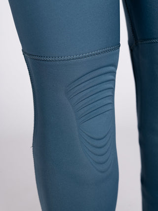 Women wearing A Series Ecoprene 3/2 Chest Zip Long Sleeve Steamer Wetsuit in Crystal Blue