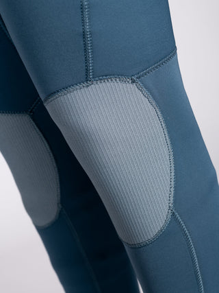 Women wearing A Series Ecoprene 3/2 Chest Zip Long Sleeve Steamer Wetsuit in Crystal Blue