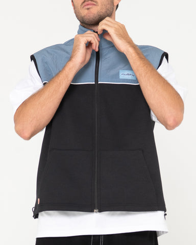 Man wearing Tekkers Unisex Fleece Vest in Coal