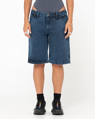 Woman wearing Flip Mommy Tapeless Low Rise Denim Short in Overdyed Blue
