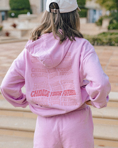 Woman wearing Choose Your Future Oversize Hoodie in Rose Bloom