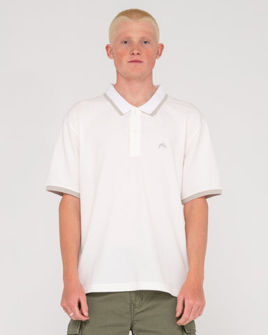 Man wearing 19th Hole Tipped Short Sleeve Polo in Ecru/oyster Grey