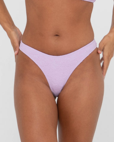 Woman wearing Sandalwood Brazilian Bikini Pant in Muted Lavender