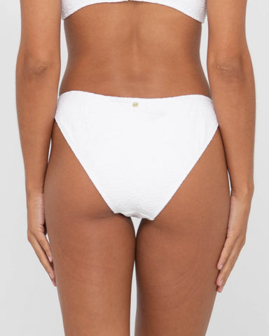 Woman wearing Sandalwood Classic Bikini Pant in Bright White
