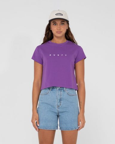 Woman wearing Rusty Essentials Classic Slim Crop Tee in Vibrant Purple