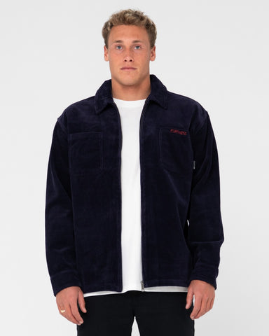 Man wearing V8 Coup Cord Jacket in Navy Blue