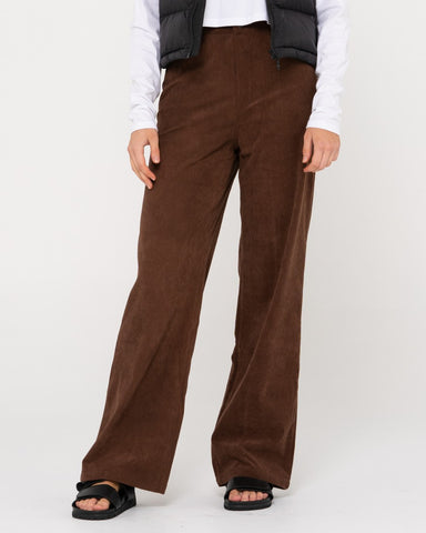 Woman wearing The Secret Cord Pant in Brown