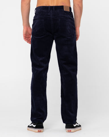 Man wearing Rifts 5 Pkt Pant in Navy Blue