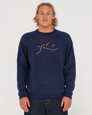 Man wearing Shadow Intarsia Knit Sweater in Navy / Gold