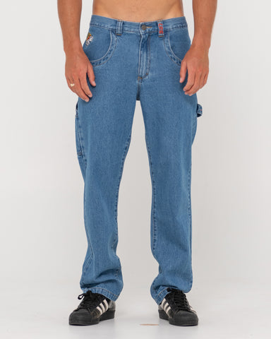 Man wearing Dungaree Denim 5 Pkt Pant-middy Blue in Middy Blue