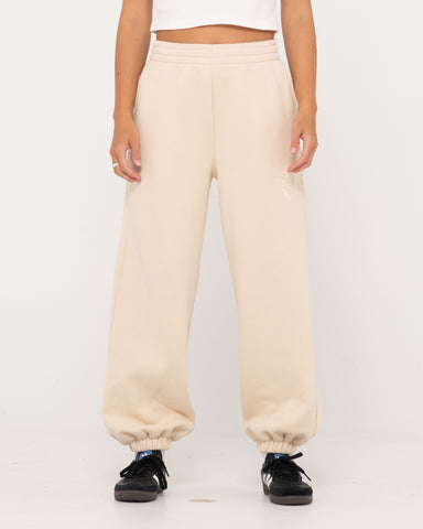 Woman wearing Rusty Signature Oversize Trackpant in Cream