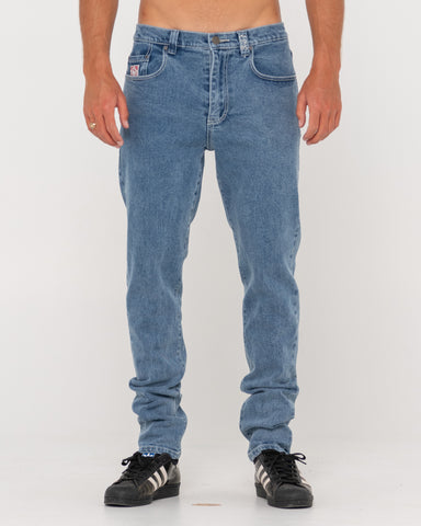Man wearing Indi Slim 5 Pocket Jean - Tgb in Trigg Blue
