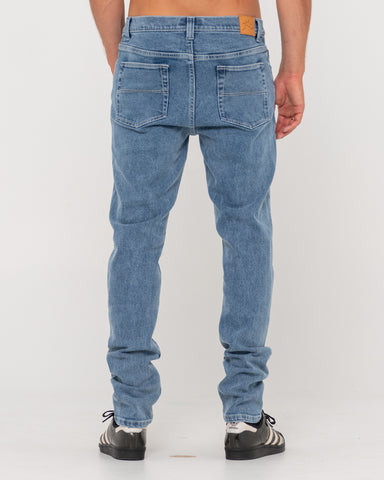 Man wearing Indi Slim 5 Pocket Jean - Tgb in Trigg Blue