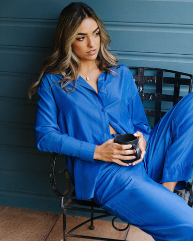 Woman wearing Porter Long Sleeve Shirt in Dazzling Blue