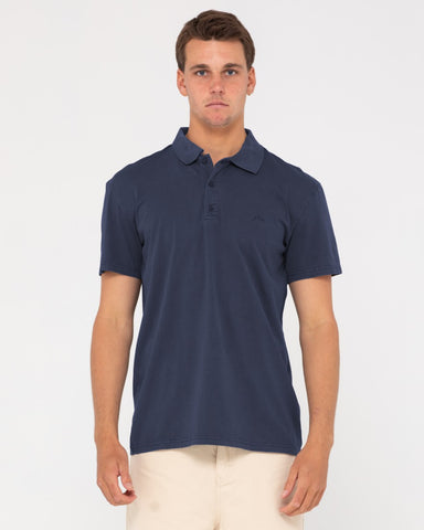 Man wearing Comp Wash Short Sleeve Polo in Navy Blue