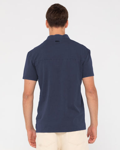 Man wearing Comp Wash Short Sleeve Polo in Navy Blue