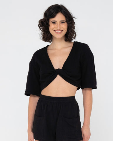 Woman wearing Somewhere Twisted Reversible Top in Black