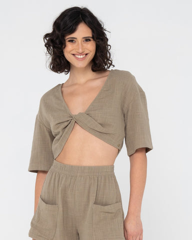 Woman wearing Somewhere Twisted Reversible Top in Olive
