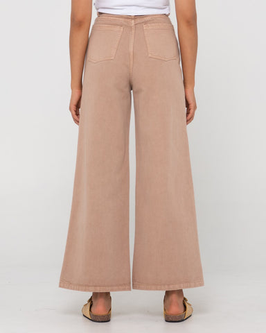 Woman wearing Hansen High Waisted Pant in Taupe