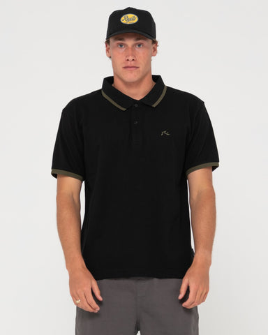Man wearing 19th Hole Tipped Short Sleeve Polo in Black/olive