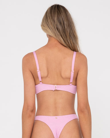 Woman wearing Sandalwood Bralette Bikini Top in Fondant Pink