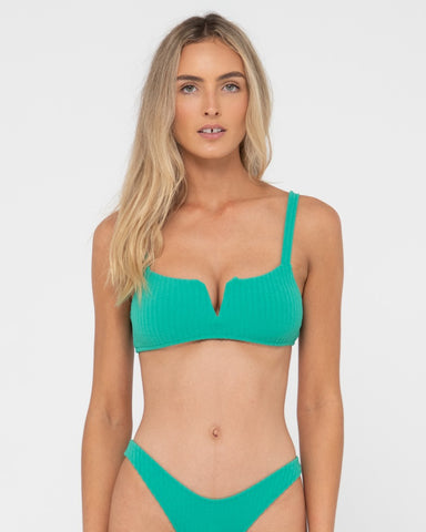 Woman wearing Lucky V Neck Bralette Bikini Top in Green