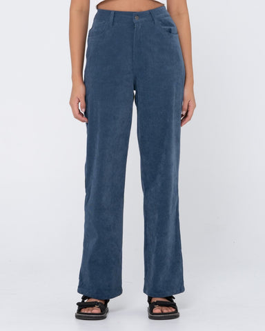 Woman wearing The Secret Cord Pant in Blue Mirage