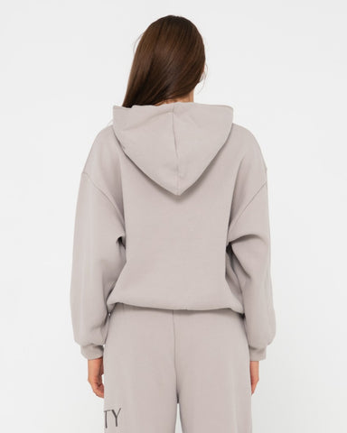 Woman wearing Rusty Signature Oversize Hooded Fleece in Grey Cloud