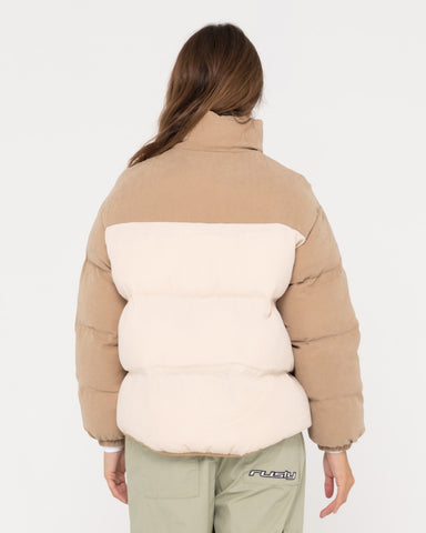 Woman wearing Tilly Zip Thorugh Contrast Puffer Jacket in Oatmilk