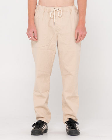 Man wearing Mid Boy Straight Fit Elastic Pant in Light Fennel