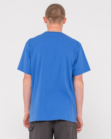 Man wearing Shadow R Short Sleeve Tee in Yonder Blue/elderber